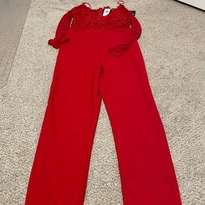 Red jumpsuit with lace and mesh top